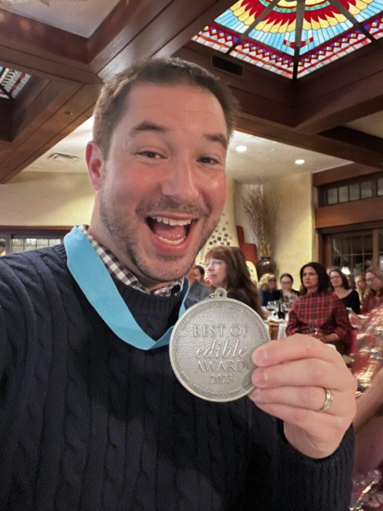 Our Publisher accepts one medal for himself and a second one for the very talented Nina Murray.